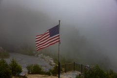 Flag at Bell Mountain in clouds Flag at Bell Mountain in clouds
