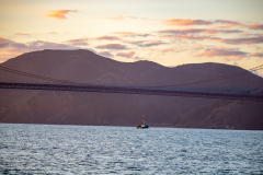 Small boat below Golden Gate Bridge Small boat below Golden Gate Bridge