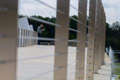 Man reading on elevated walkway Man reading on elevated walkway